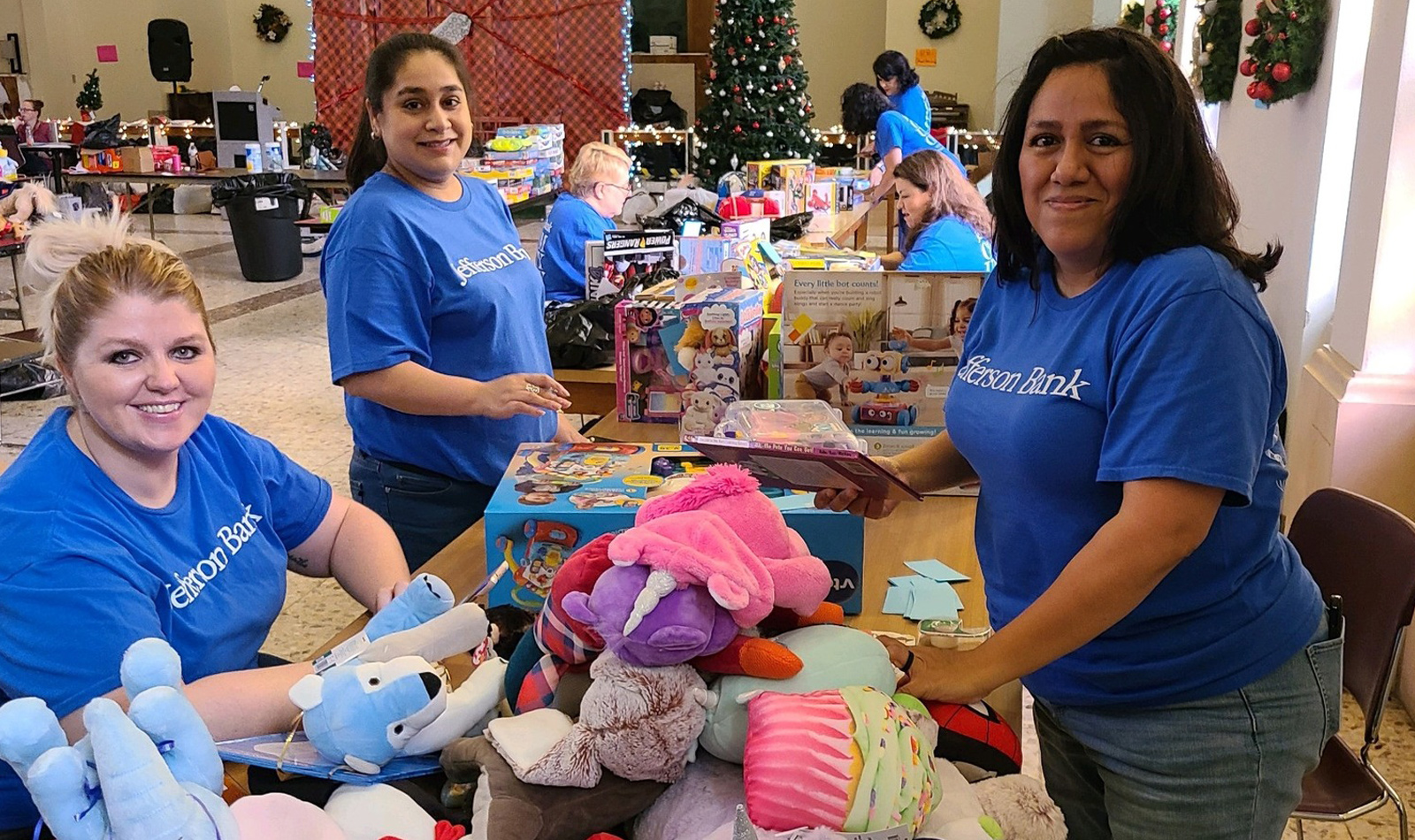 Team building volunteer event with SAMMinistries sorting and pricing  donated Christmas gifts to be distributed to children/families participating in  SAMMinistries programming. pictured left to right: Ashley Campbell (BSA),  Brenda Reyes (BSA), and Rosie Uriegas (BSA)
