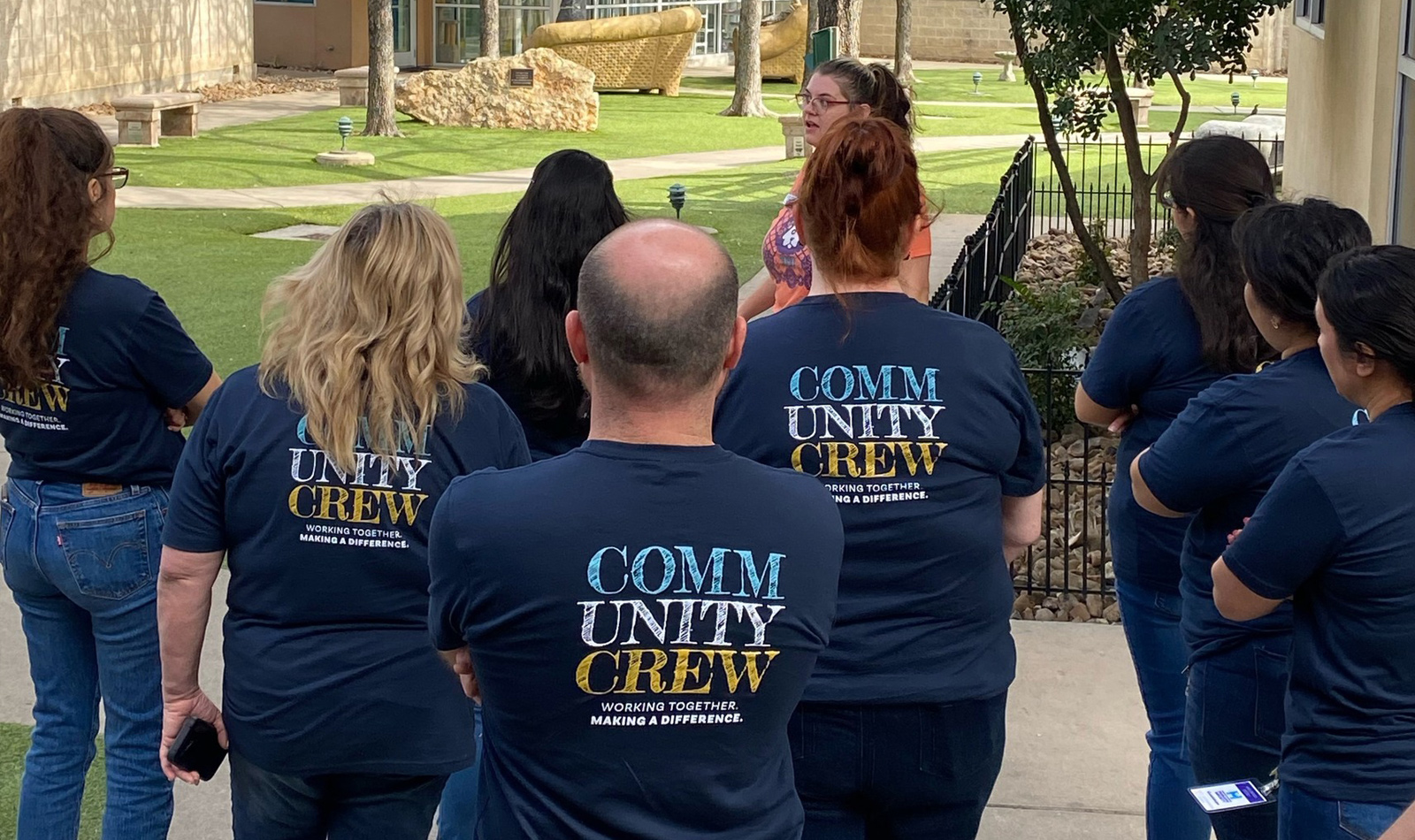 Jefferson Bank volunteers getting a tour of the San Antonio Humane  Society before a day volunteering in their Pup-arazzi volunteer event.