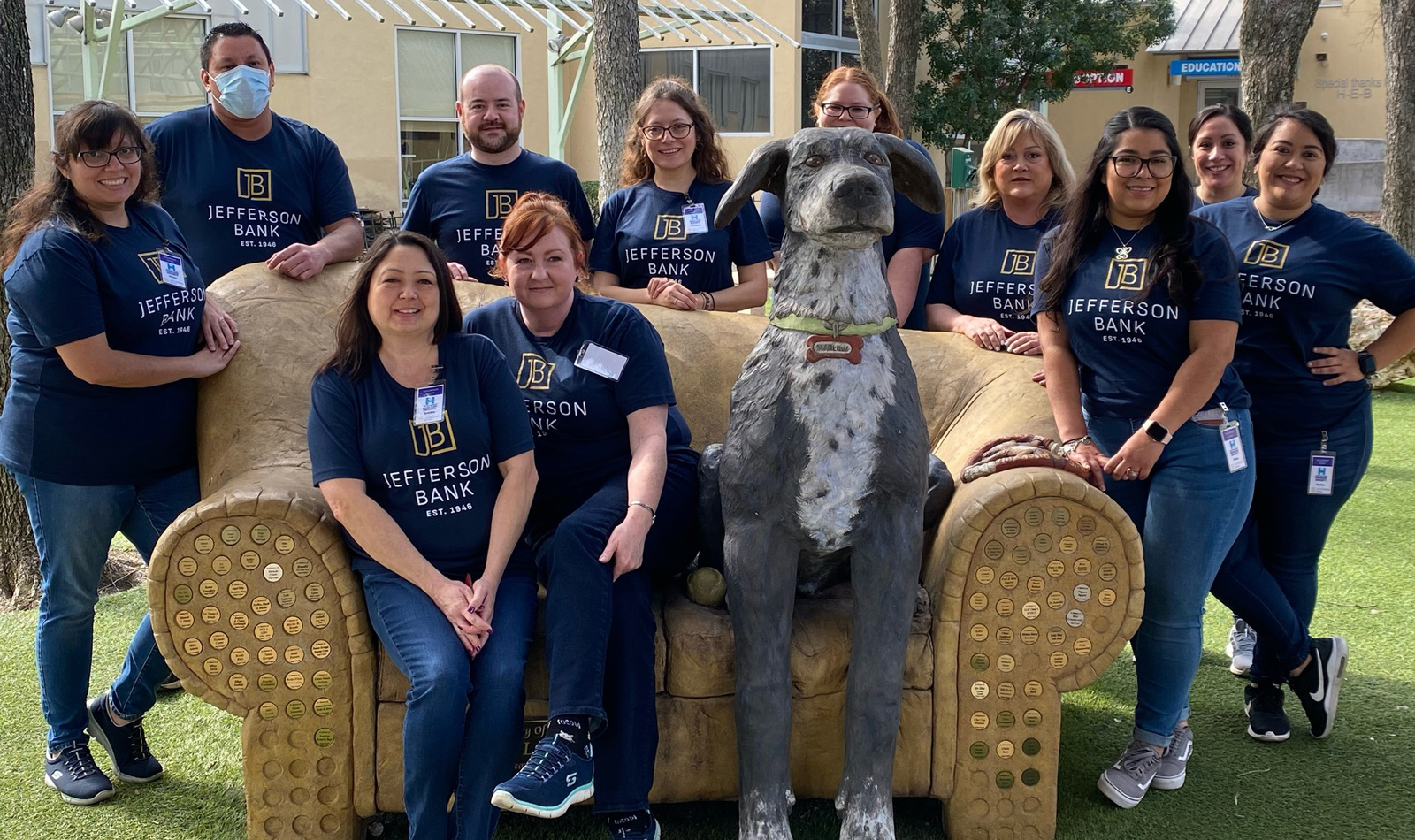 Group photo of volunteers who attended the SA Humane Society’s  Pup-arazzi volunteer event. Pictured left to right top: Ayssa Wilcia (Training),  Isaac Jimenez (Loan Ops), Robert Ochoa (President of SA Humane Society Board of Directors/Commercial), Christina Garza (Mortgage), Stevie Gaskins  (Customer Contact Center), Melissa Akers (Mortgage), Vilma Pena (Private  Banking), Lupe Garcia (Deposit Ops), and Yvette Burgos (Fraud)  Bottom: Debbie Andrew (Compliance) and Kathy Cunningham (Accounting)