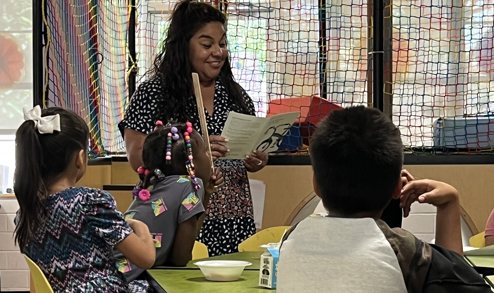 Melody Esquivel (Human Resources) teaching the Money Monsters  financial literacy to participants (K-5) in SAMMinistries’ After School Program.