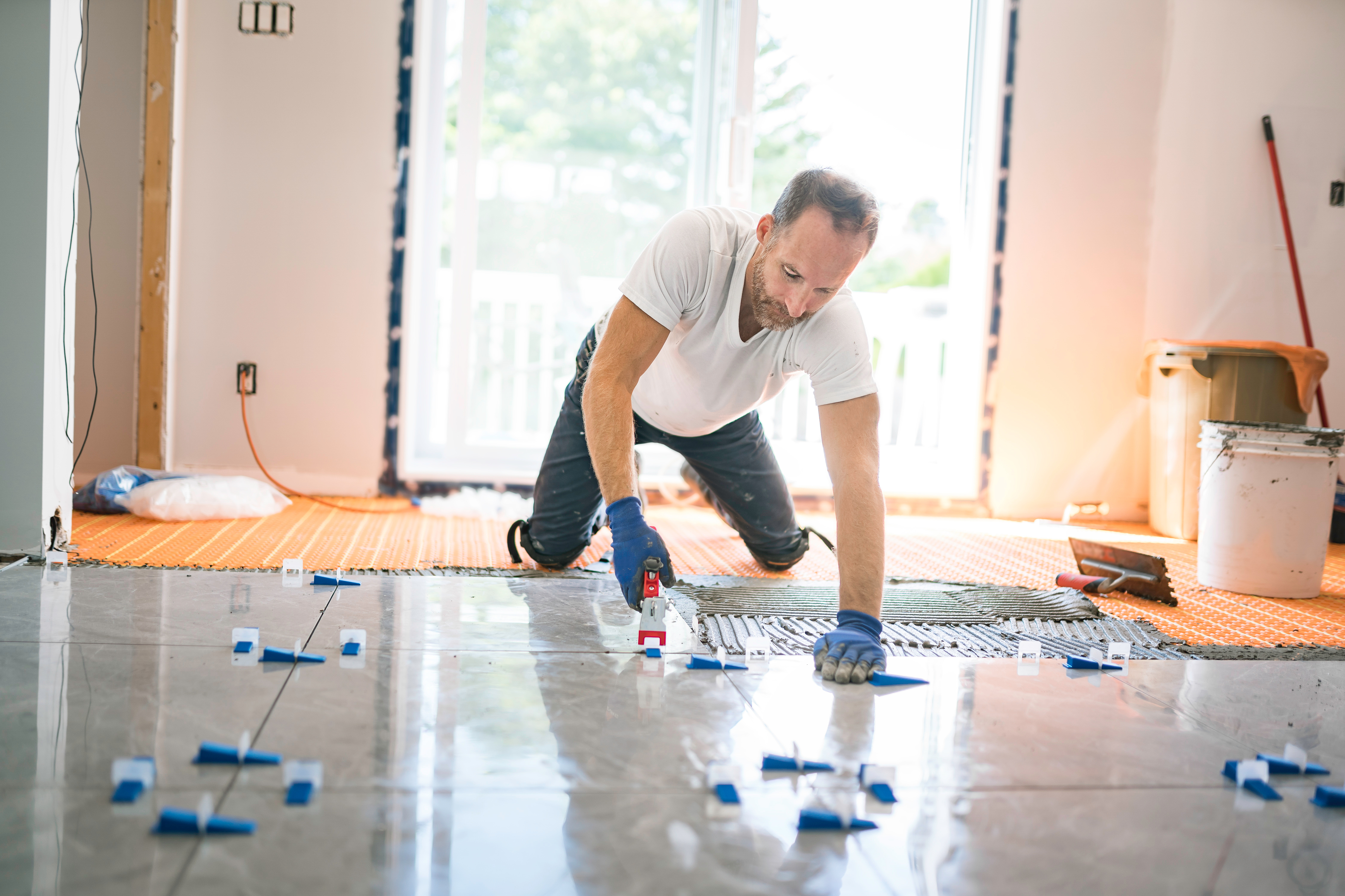 nice handyman install tile on the floor