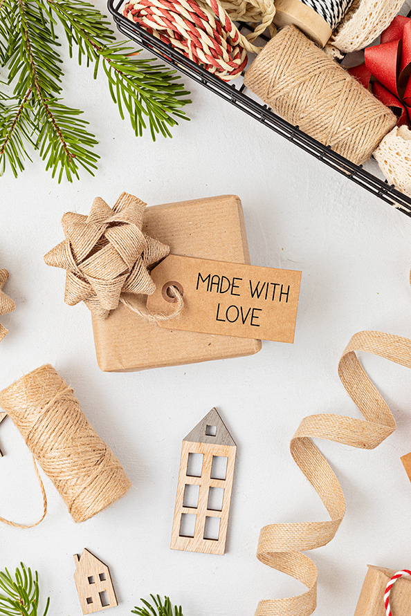 Handmade holiday gift with tag reading Made With Love symbolizing thoughtful low-cost giving ideas
