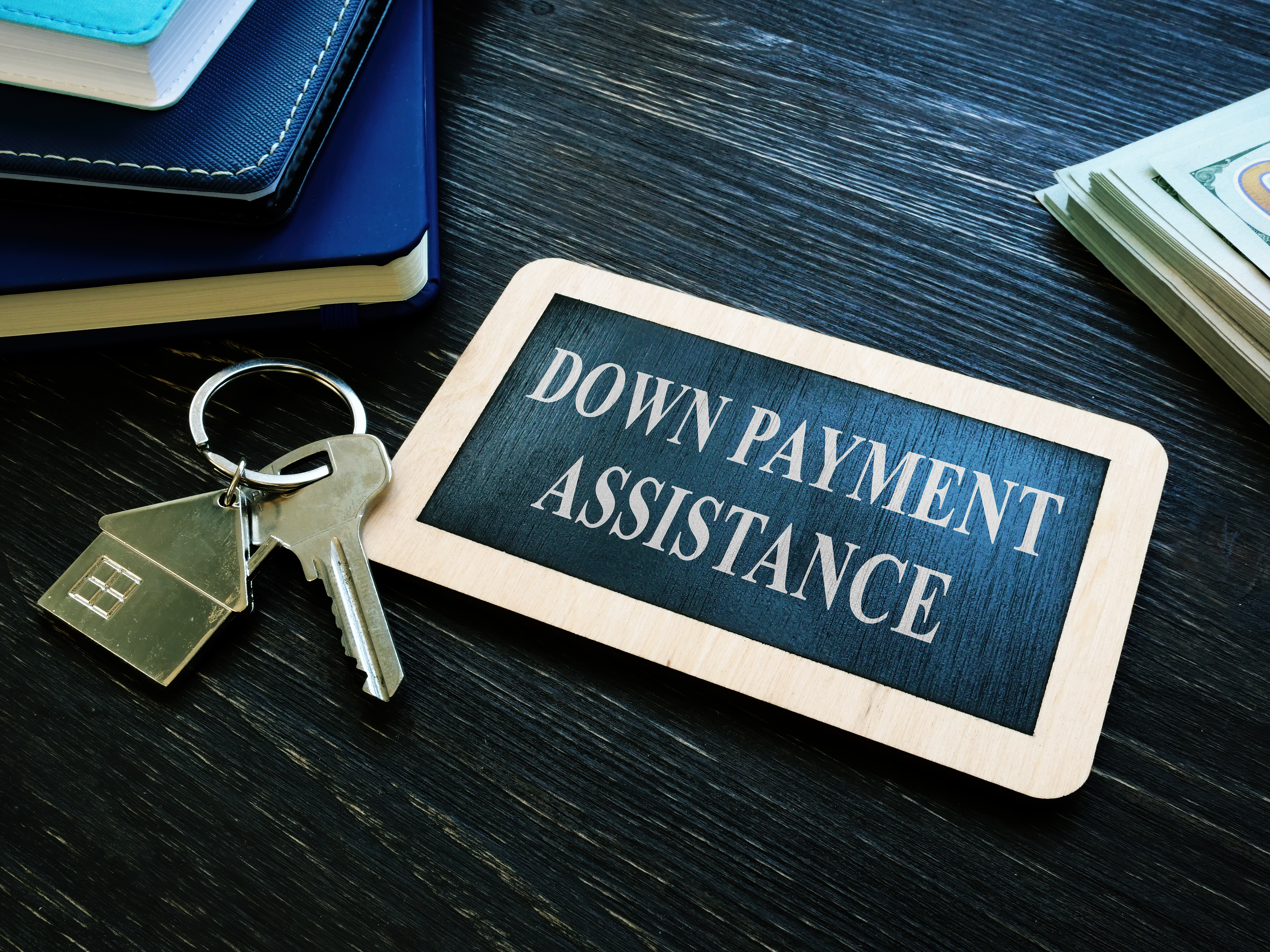 Keys and sign representing down payment assistance for Texas homebuyers