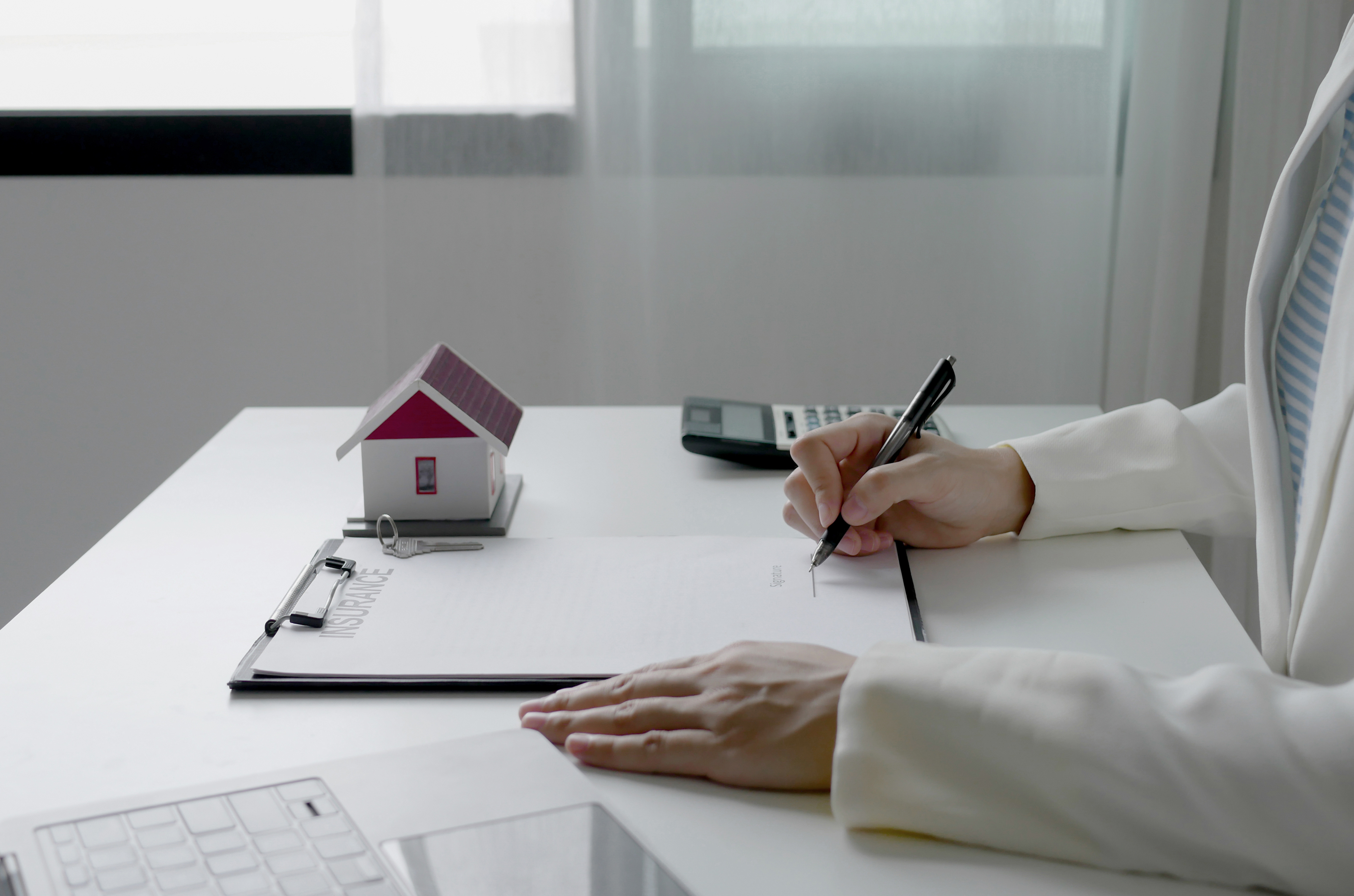 Mortgage paperwork being signed for Texas homeownership assistance programs