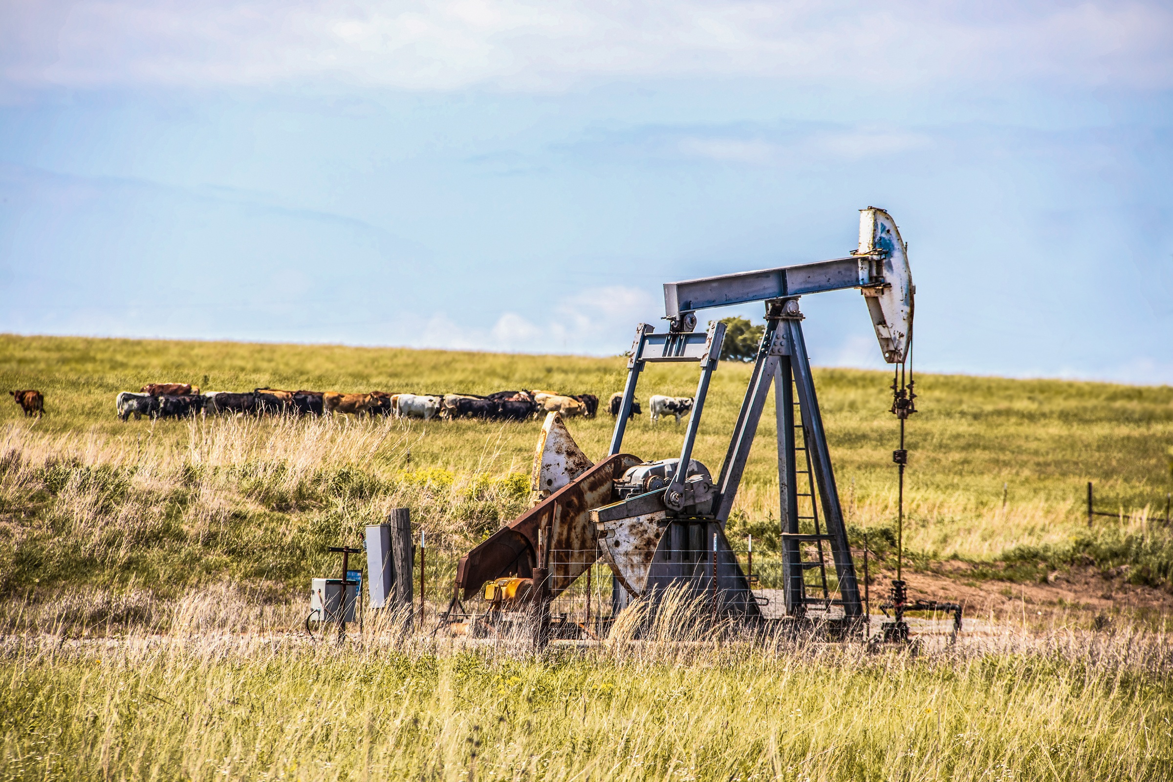 Oil pumpjack on rural land illustrating mineral rights ownership and royalty income generation
