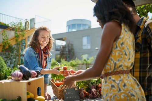 An exchange at a farmers market. 