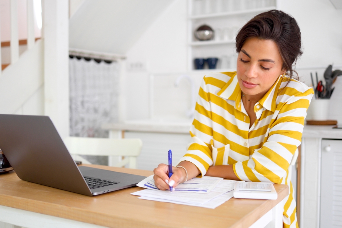 woman budgeting from home wealth strategy