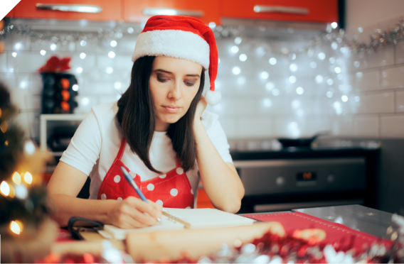 Woman writing a Christmas List