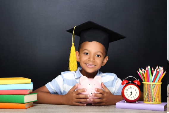 child saving for college in his piggy bank