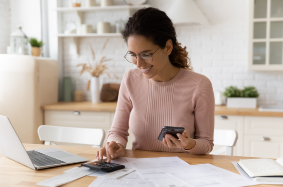 woman using calculator to budget