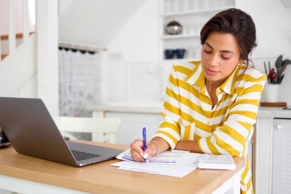 woman budgeting from home wealth strategy