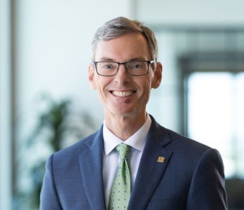 Man smiling in headshot
