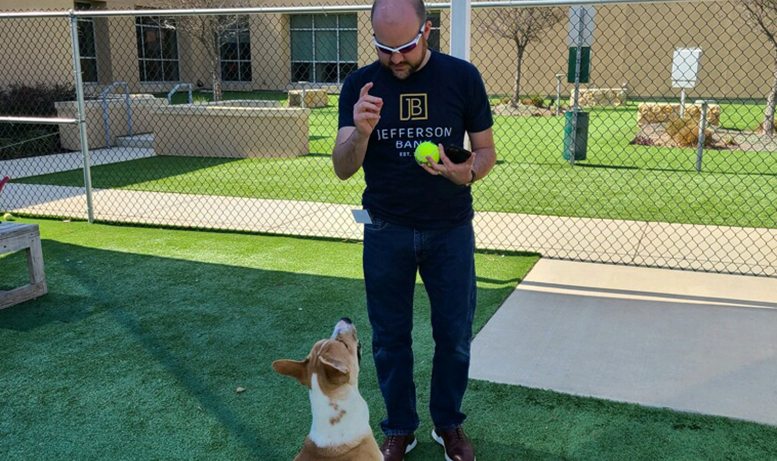 Robert Ochoa (Commercial) trying to get the perfect pose with one  of the Humane Society’s residents during the Pup-arazzi event where volunteers  were tasked with shooting photos and videos of dogs who were ready for  adoption.